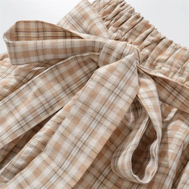 KEYANKETIAN 2025 Letnia nowa damska mini spódniczka w kratę w stylu preppy z kokardką i elastyczną talią A Line Puffy Skirt Fashion Pantskirt