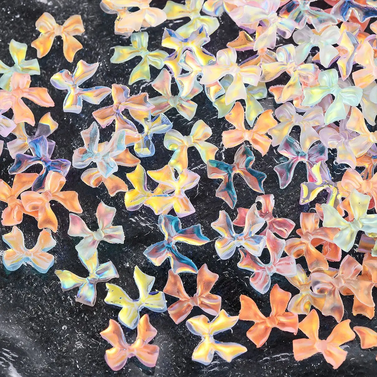 ชาร์มตกแต่งเล็บริบบิ้นออโรร่ามอคค่า 50 ชิ้น คละสี อุปกรณ์ตกแต่งเล็บ 3 มิติ เรซิ่น ประดับเล็บ อุปกรณ์ทำเล็บ