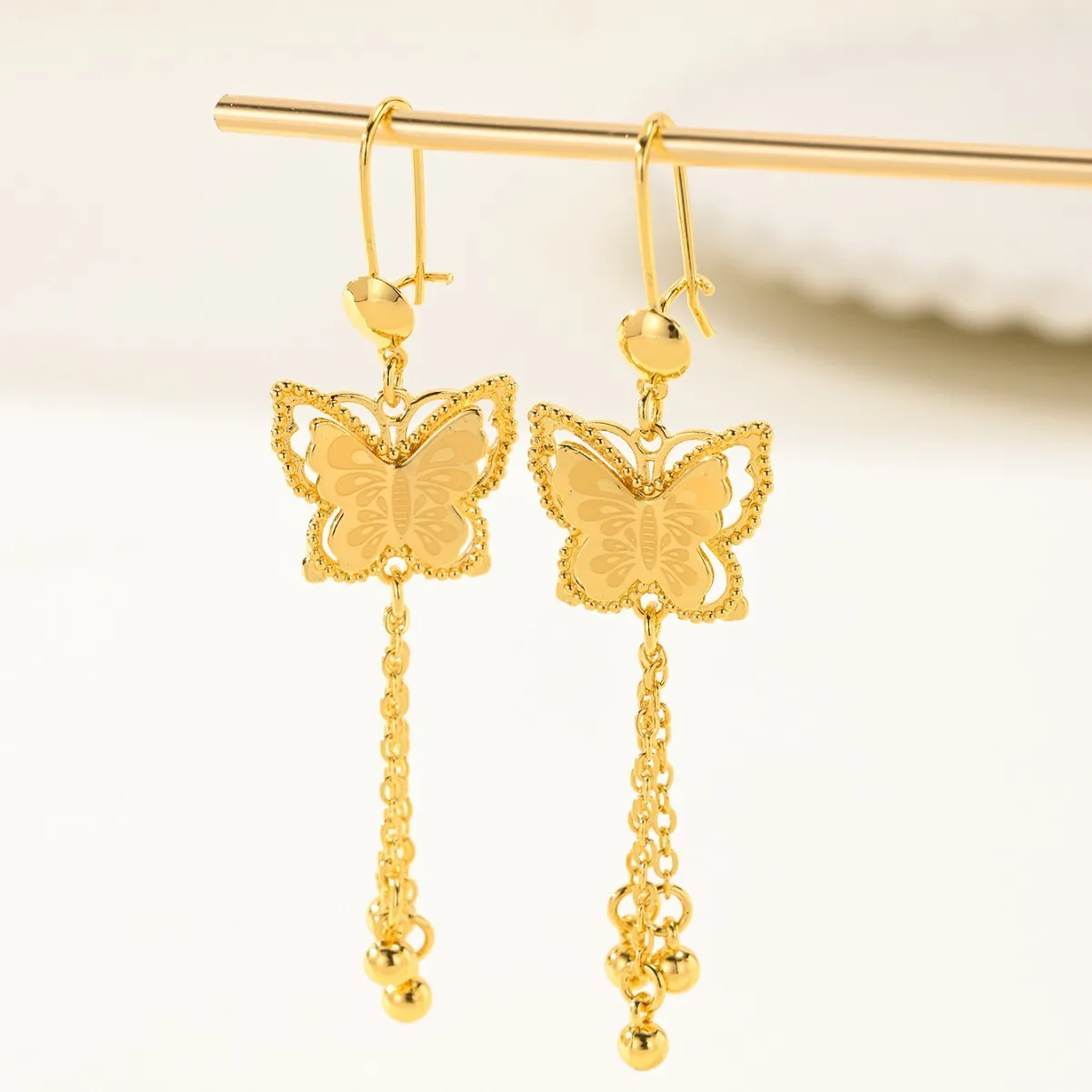 9999 gold long-style butterfly fringed bell earrings - vintage ethnic style, high-end earrings