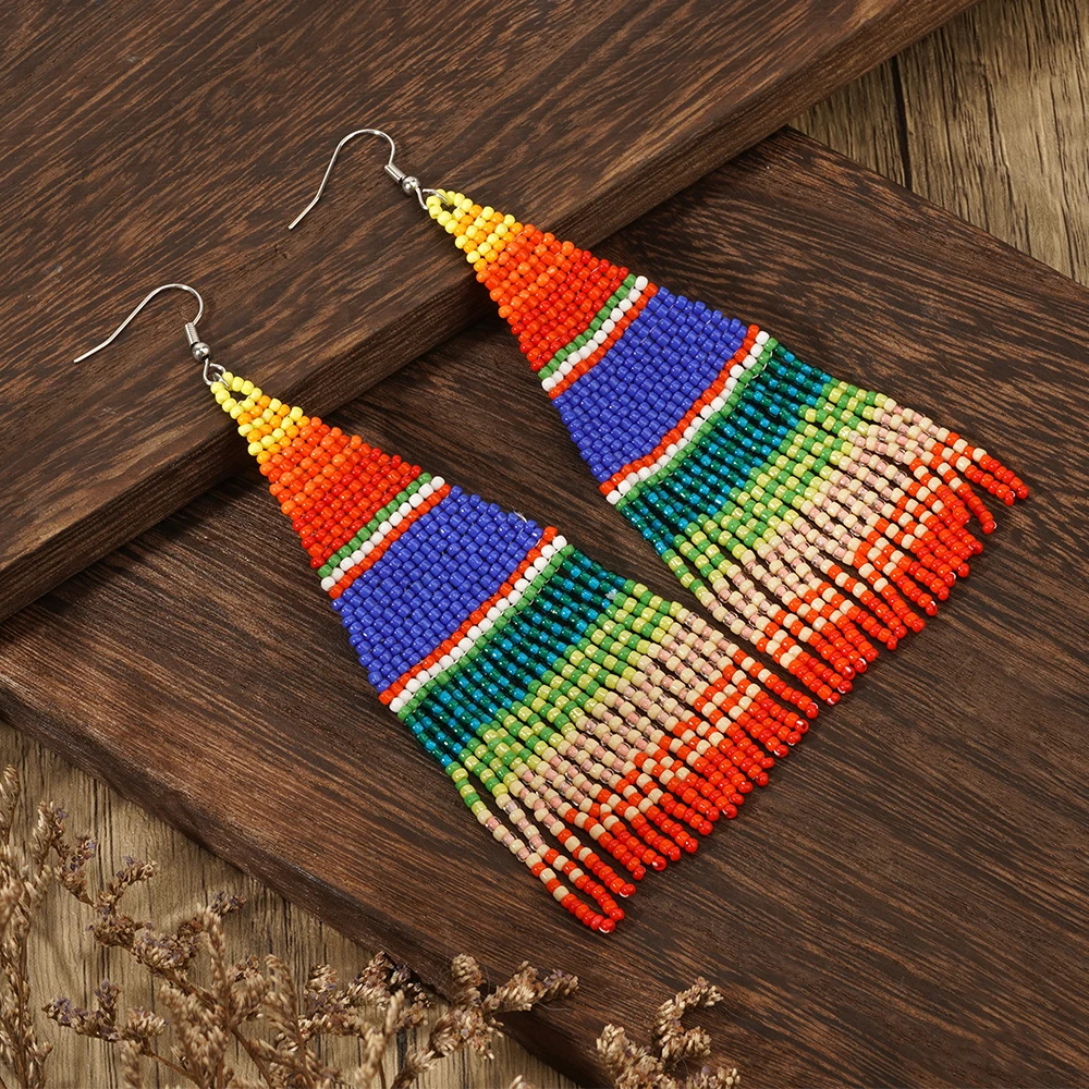 A pair of colorful striped Bohemian vacation style Su Mi bead woven earrings, hand woven earrings accessories