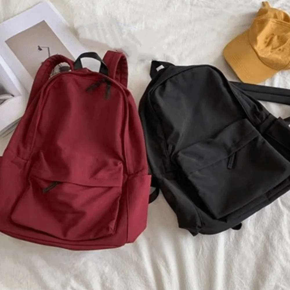 Tas Ransel Siswa Modern Kapasitas Besar Bahan Nylon Kasual Warna Solid Tali Dapat Disesuaikan Tas Travel Sekolah