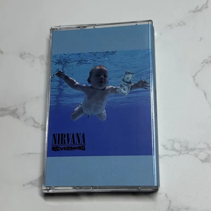 

The album cassette of an American rock band defining the voice of a generation, unopened with lyrics, has excellent appearance