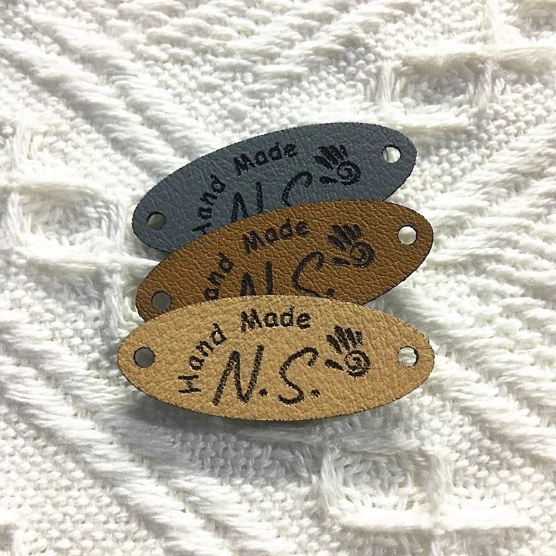 

30pcs Personalized Sewing leather labels for Knitting garment Handmade hats tags customize logo Oval Clothes crochet Accessories