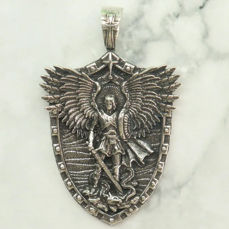 Buy 4 Get 1 Free This stainless steel Saint Michael pendant forges the Archangel's full emblems into one: the sword of judgment
