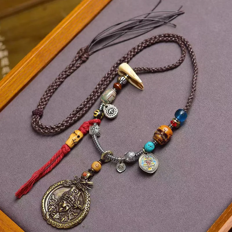 -woven rope necklace with a hand-crafted of the Yellow Wealth God Gahu box, and an old iron pendant of Zaki Ram