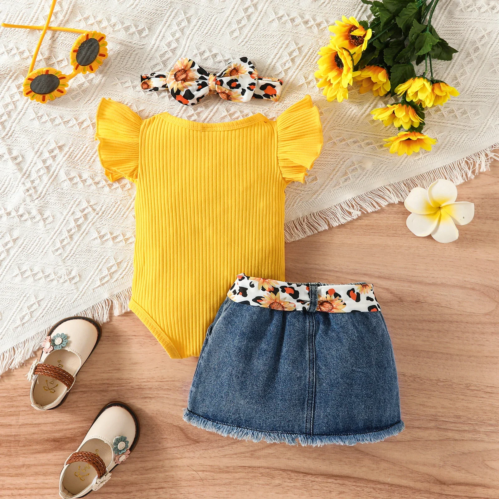 PatPat 3pcs Baby Girl 100% Cotton Belted Ripped Denim Skirt and Letter Print Ribbed Flutter-sleeve Romper & Headband Set