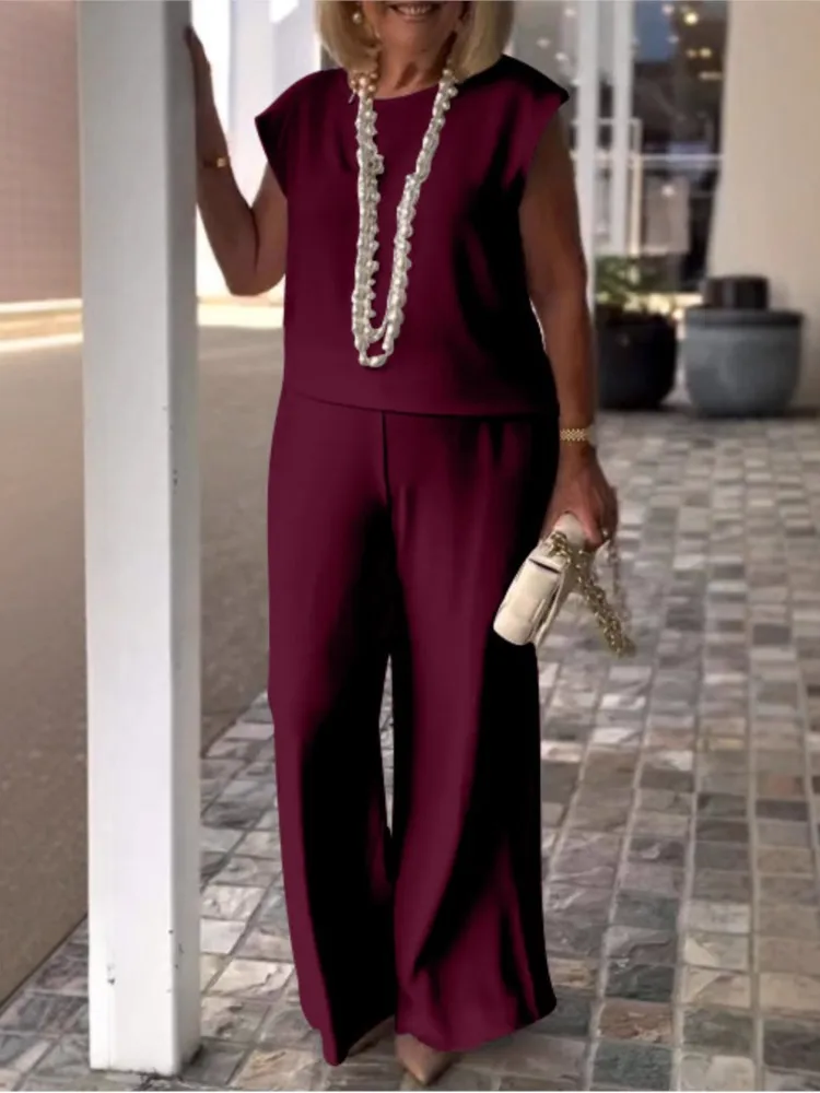 

Женский костюм-двойка: однотонный топ с круглым вырезом + свободные брюки с широкими штанинами, повседневный, элегантный, для офиса, на каждый день, для отпуска, комплект из 2 предметов, 2026