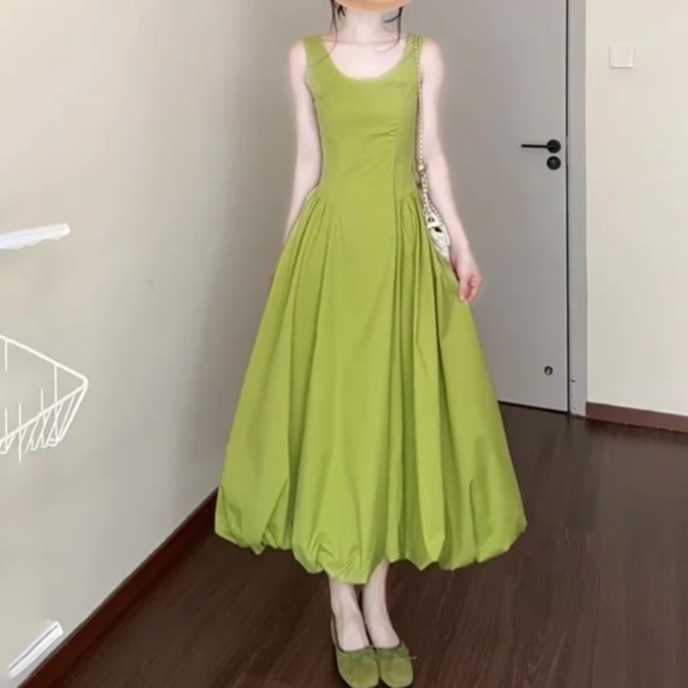 

Seaside holiday wind green suspender dress children's summer 2026 new beautiful non-collision waist bud skirt