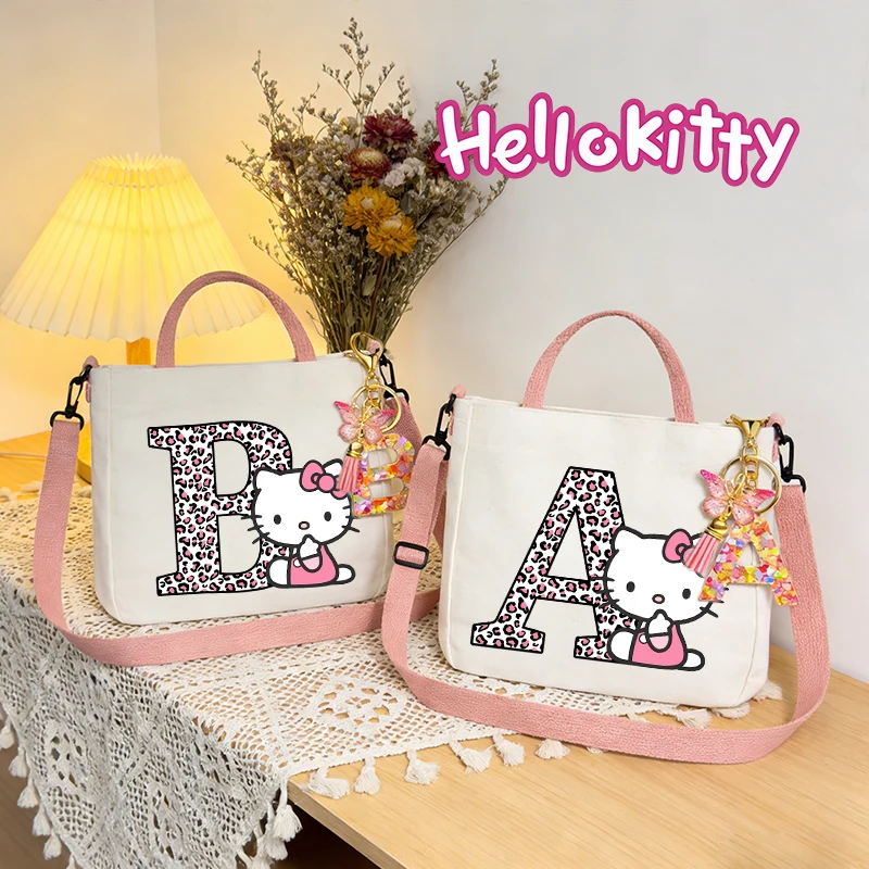 

Sanrio HelloKitty Girl Shoulder Bag Letter Keychain Women Pink Tote Bag Cartoon KT Cat Canvas Handbag Fashion Crossbody Bag Gift