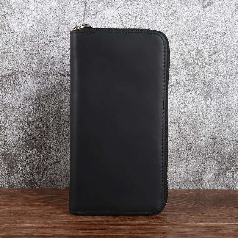 Leather men's long-handled handbag made of top-grade cowhide, with a zipper closure. An elegant retro handmade casual money clip