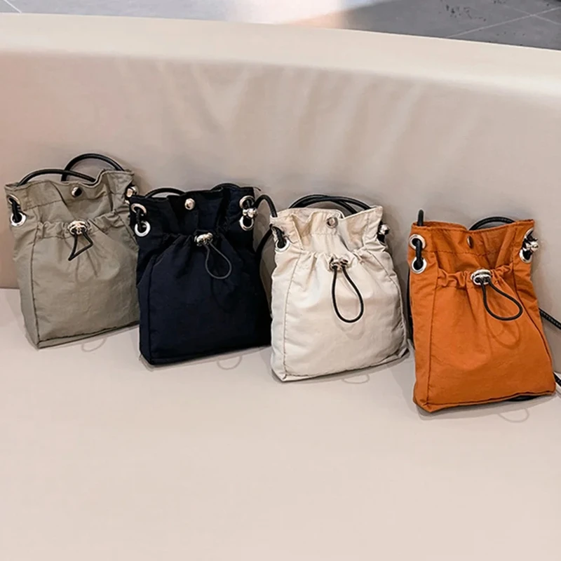 Bolso cruzado de nailon versátil para teléfono, Mochila pequeña y ligera para salir, funda para auriculares con cambio suelto Simple y moderno