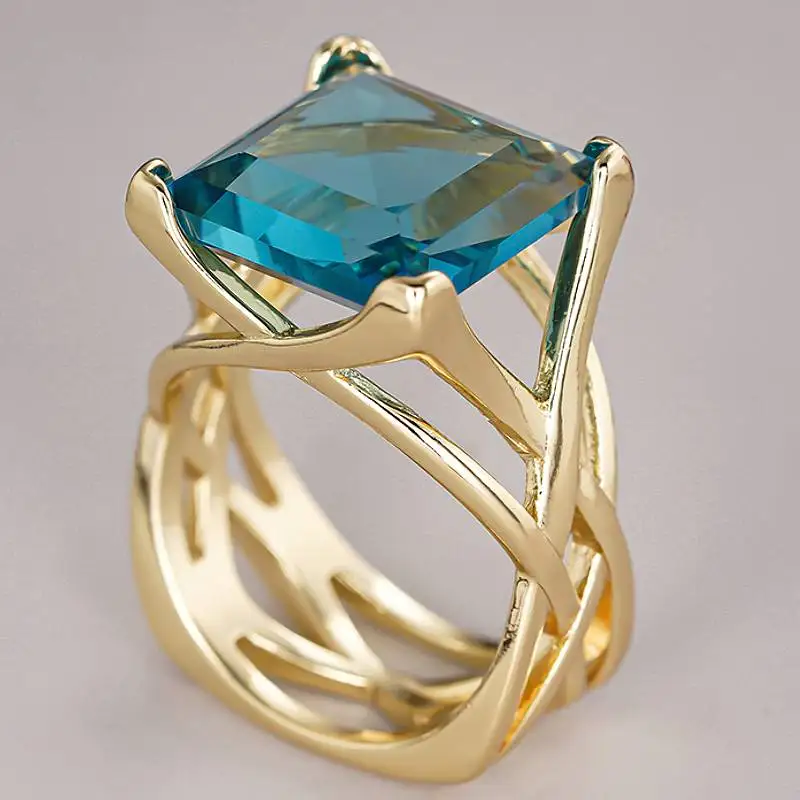 Huitan Ring mit hohlem Kreuz-Design für Damen, goldfarben, mit leuchtend weiß/blauem CZ, modisches Hochzeitszubehör, eleganter Partyschmuck