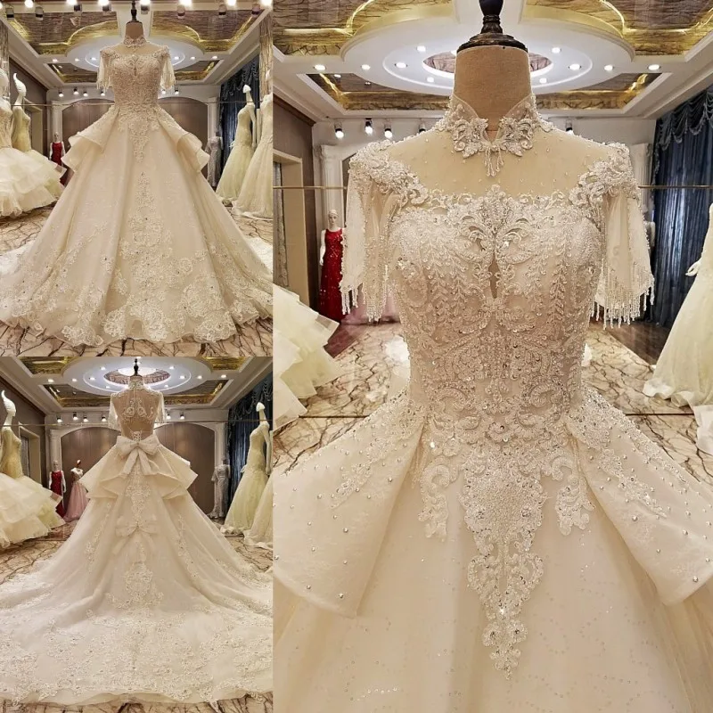 Abiti da sposa arabi di lusso cristalli pizzo collo alto abiti da sposa perline Appliques Royal Train abiti da sposa con fiocco