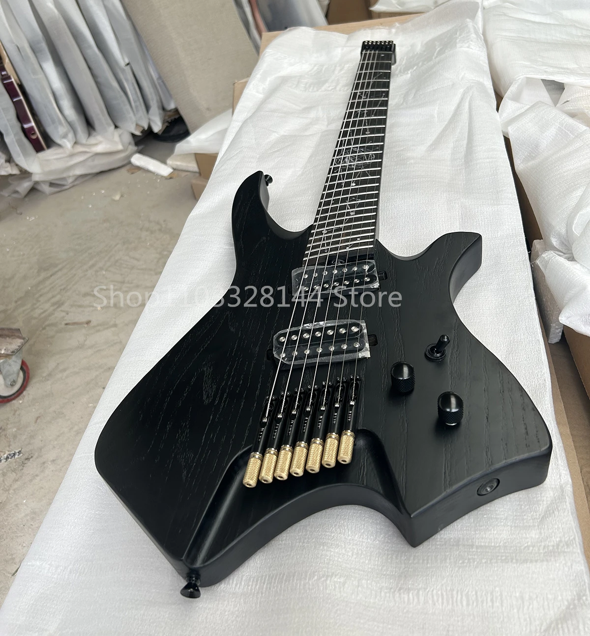 Factory Headless 6 and 7 Strings Electric Guitar Ebony Fretboard Ash Body Maple Neck Customizable