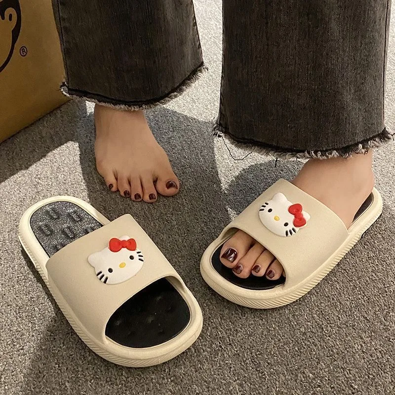 Cute cartoon cat wearing Hello Kitty slippers for women with thick soles and a sense of stepping on poop Indoor non slip slipper