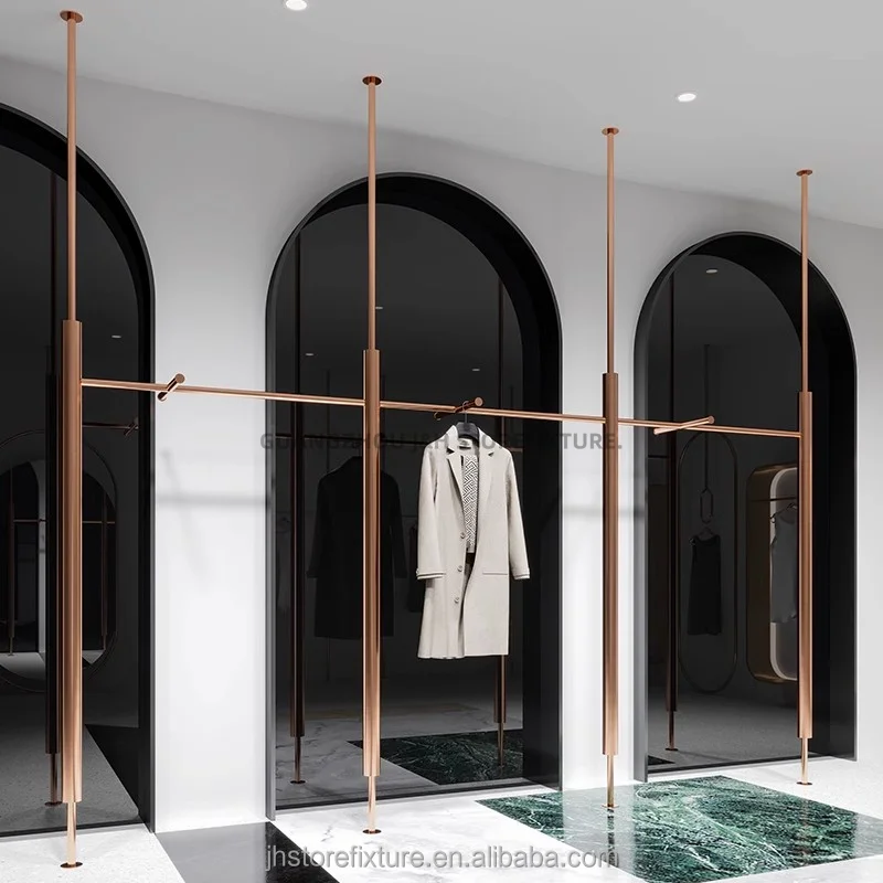 Estantes de exhibición de tienda de mujer de acero inoxidable de exhibición de tienda de mujer de oro rosa de tamaño personalizado para Boutique