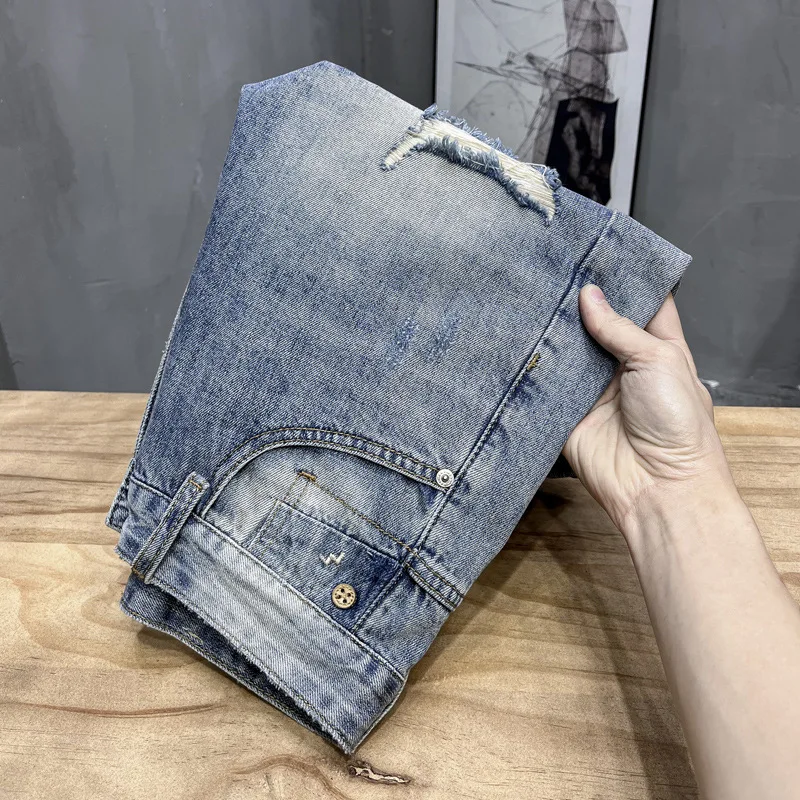 Pantaloncini di jeans strappati estivi 2024 pantaloni di marca di moda traspiranti elasticizzati sottili da uomo pantaloni corti Casual di fascia alta per tutti i fiammiferi