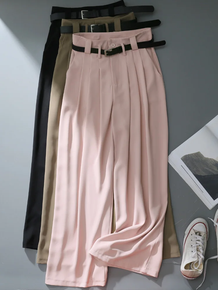 بنطلون نسائي واسع الساق بخصر مرتفع باللون الوردي، سروال فضفاض طويل يصل للأرض يخفي الوركين ويمنح مظهراً نحيفاً