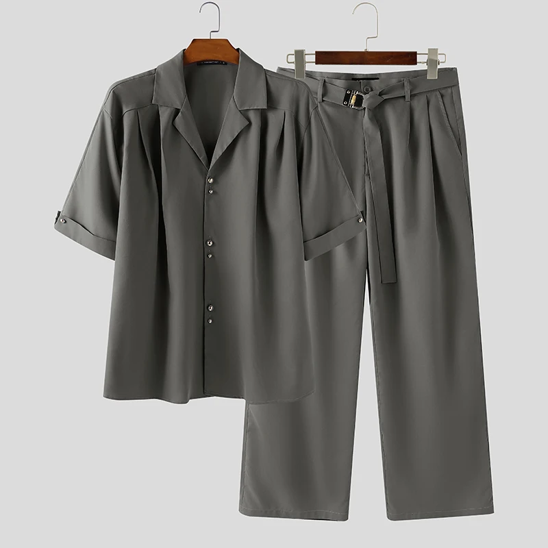 

INCERUN Мужские комплекты Однотонная рубашка с короткими рукавами и брюки с лацканами Комплекты из двух предметов Уличная одежда Свободные модные мужские повседневные костюмы 2025 года