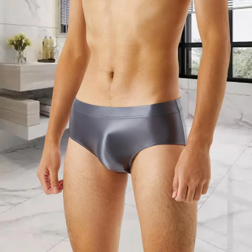 Calzoncillos elásticos para hombre, ropa interior Sexy sin costuras, brillante, de una pieza, Color sólido