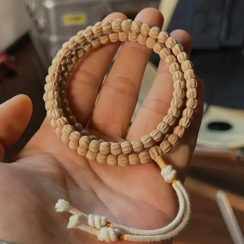 

Hot-selling Baixiangzi 108 hand-held prayer beads, original deep-pit cypress seeds, high-quality, with distinctive multi-faceted