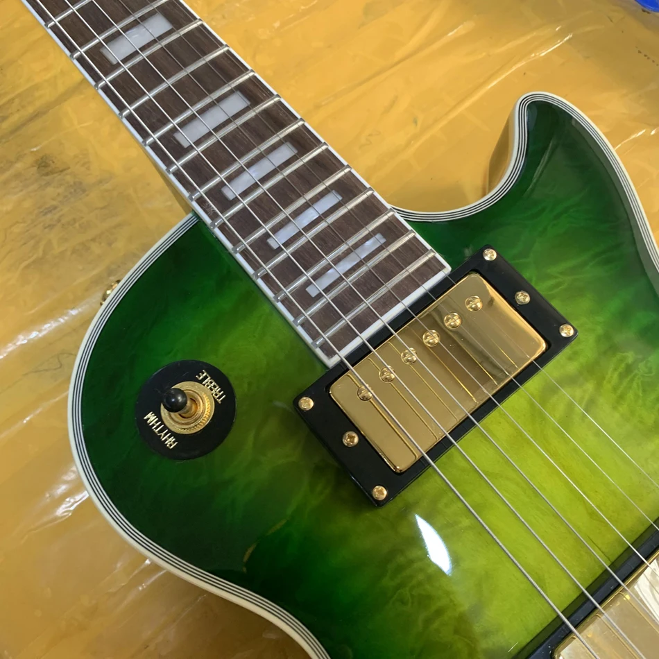 Electric guitar with green maple top, gold hardware, rosewood fingerboard