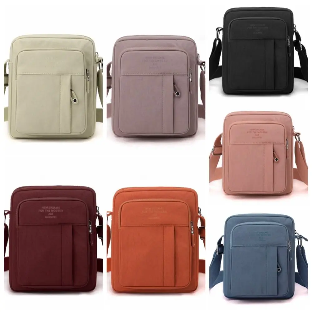 حقيبة كتف كاجوال من النايلون بلون سادة متعددة الطبقات خفيفة الوزن في منتصف العمر على الطراز الكوري حقيبة كروس متعددة الجيوب يوميًا