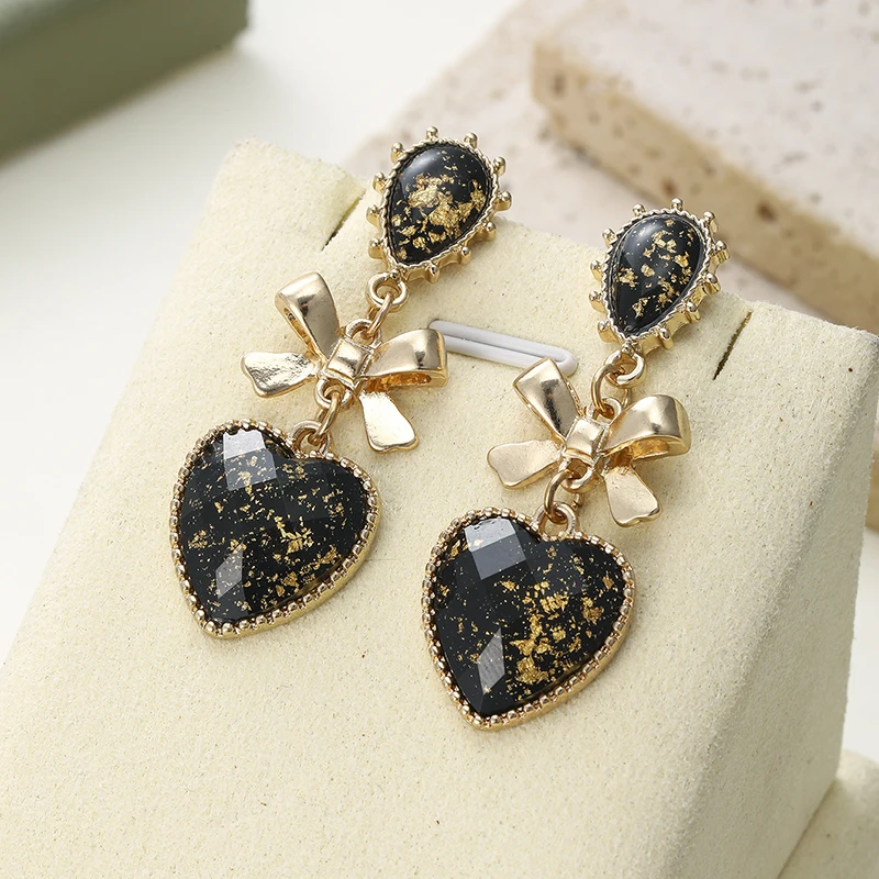 A Pair of Retro and Elegant Heart-shaped Bow Earrings Suitable for Women To Wear Jewelry Gifts on Dates Commutes and Parties