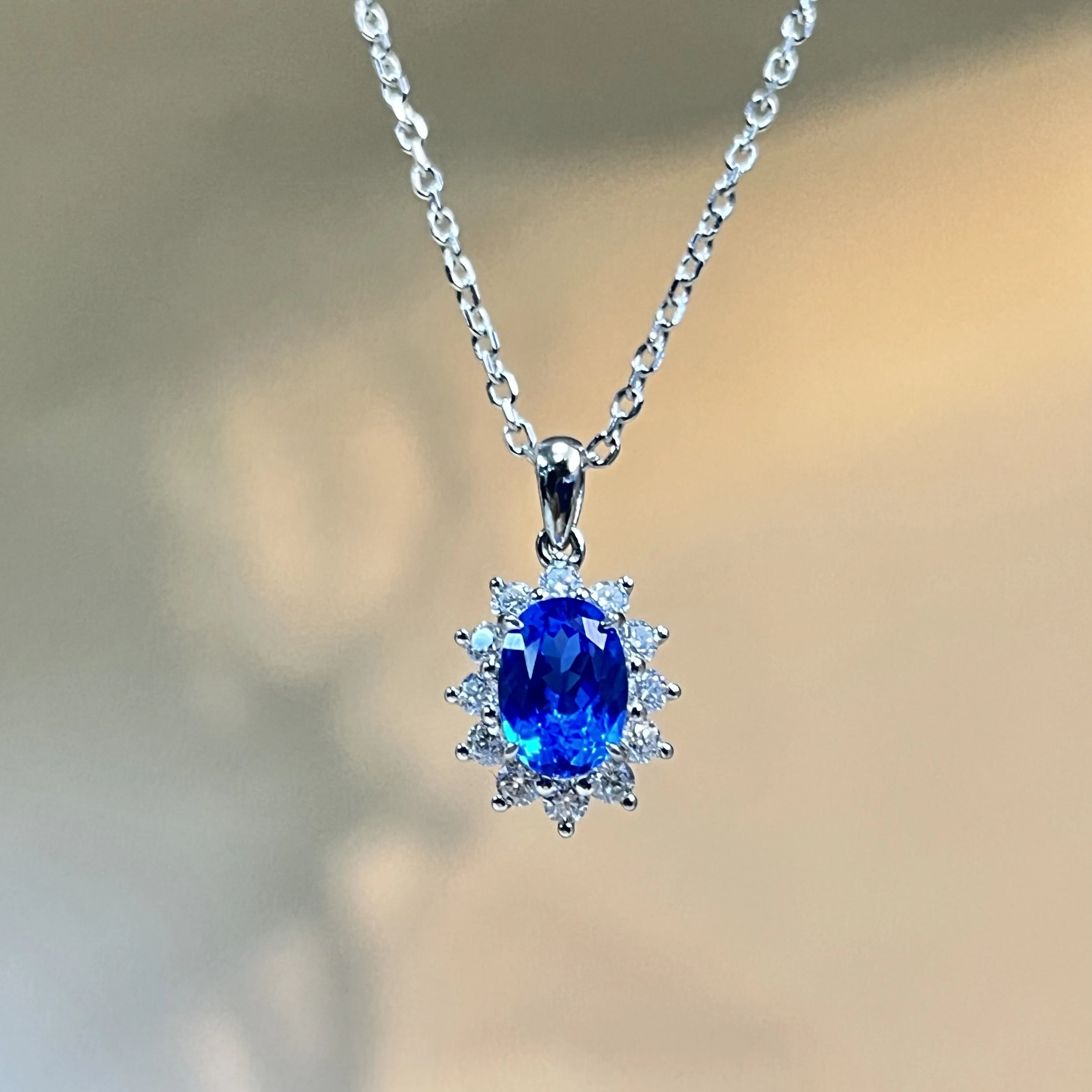S925 sterling silver cultured sapphire necklace with classic everyday surround-set diamond pendant design.