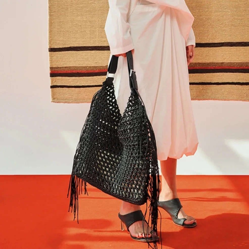 

Tassel hollow woven handbag 2025 new niche design summer vacation beach bag large capacity fashion women's one-shoulder tote bag