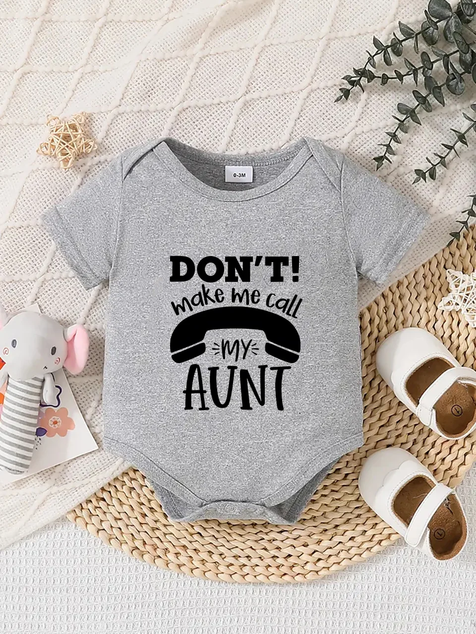 

Playful letter-printed baby short-sleeve triangle bodysuit. Button closure for easy dressing, machine washable