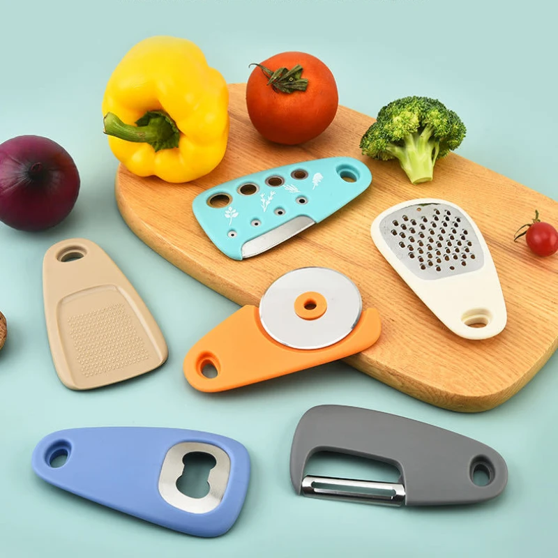 

Unique Gadgets Set 6 Pieces,Grater, Bottle Opener, Fruit Vegetable Peeler, Pizza Cutter, Garlic Ginger Grinder, Herb Stripper