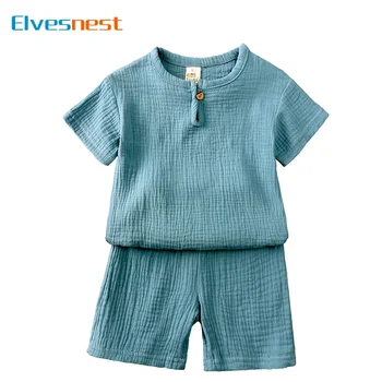 Vestiti per bambini in cotone e lino Completi per ragazze Set di vestiti estivi per ragazzi Tinta unita Top a maniche corte Pantaloncini Abbigliamento per bambini 2-7 anni