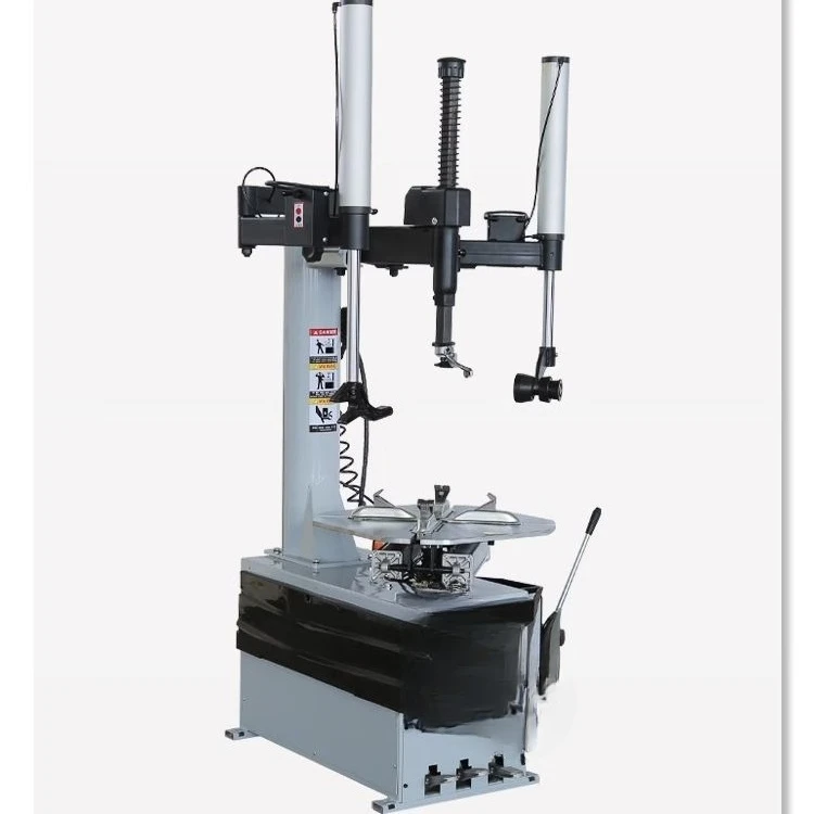 Машина для разборки и сборки автомобиля. Машина для снятия шин с двойным вспомогательным рычагом влево и вправо.