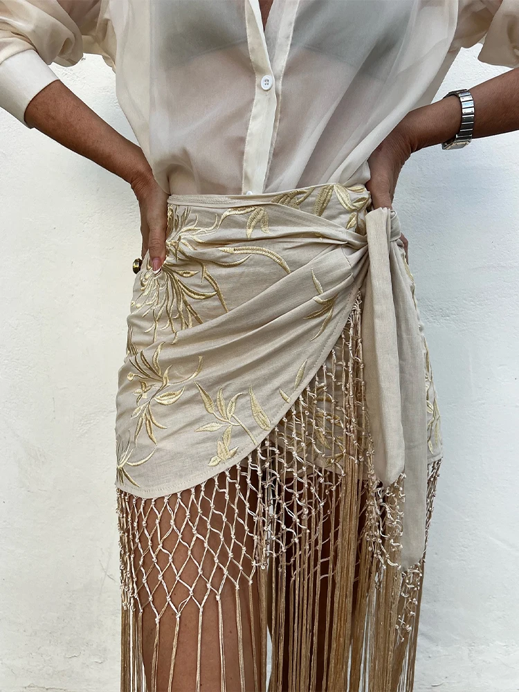 موضة شرابة المنسوجة ميدي تنورة المرأة أنيقة غير المتماثلة التجاعيد حزام أسفل 2025 جديد الصيف عطلة الشارع الشاطئ ملابس للسيدات