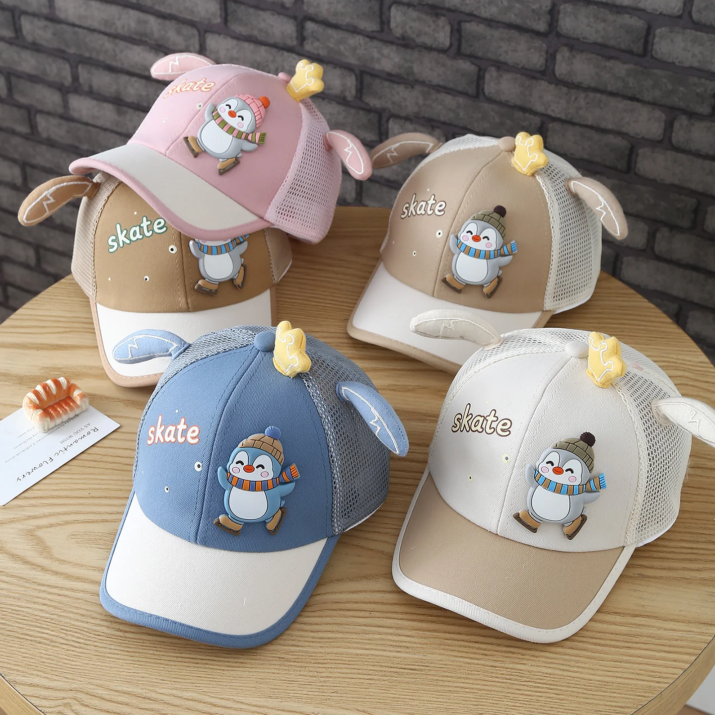 Patchwork Printed Mesh Baseball Cap with Cute Little Penguin Logo on the Crown and Ear-Shaped Decorations. Fun Hat for Children