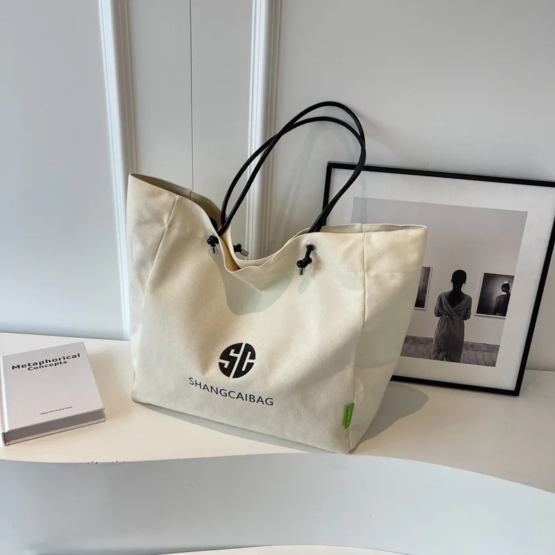 Large Capacity Canvas Tote Bag Women 2026 New Simple Letter Print Single Shoulder Handbag Commuter Bag Casual Travel Style