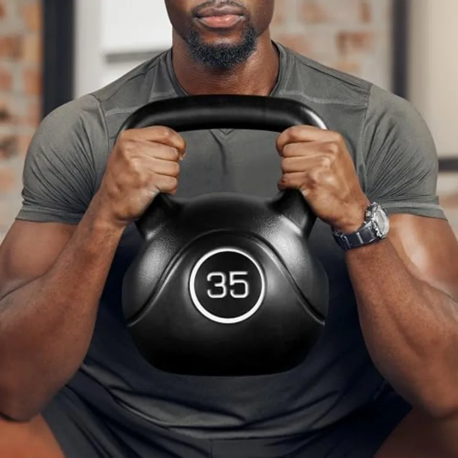 Home gym kettlebell weights for men and women: 35lbs cast iron kettlebell in black with wide flat base and textured grip for st