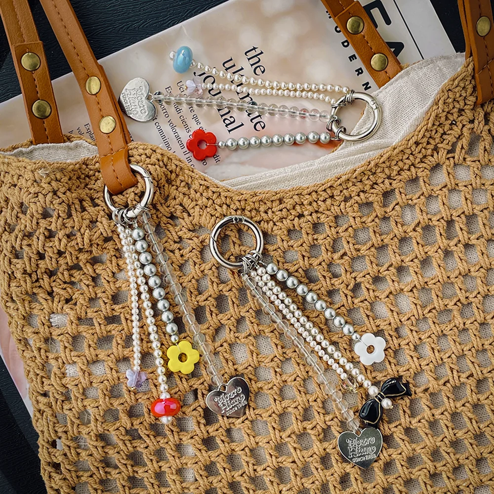 Original new product: simple pearl flower butterfly heart bow niche phone bag accessory keychain