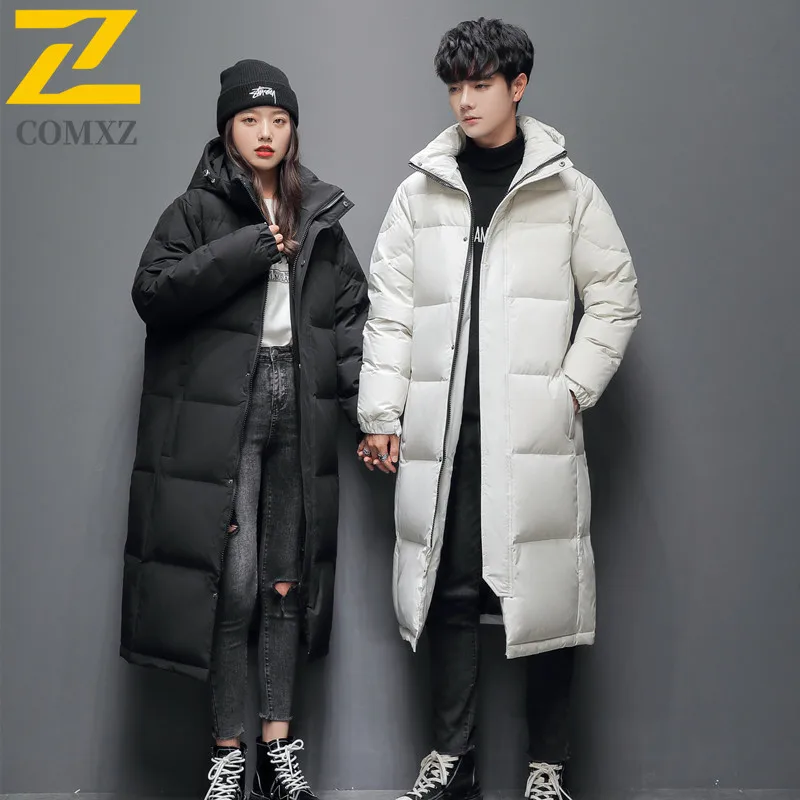 سترة COMXZ الفاخرة للجنسين بلون سادة مع قلنسوة للمشي لمسافات طويلة والسفر معطف طويل دافئ عالي الجودة من ريش البط الأبيض للشتاء #1