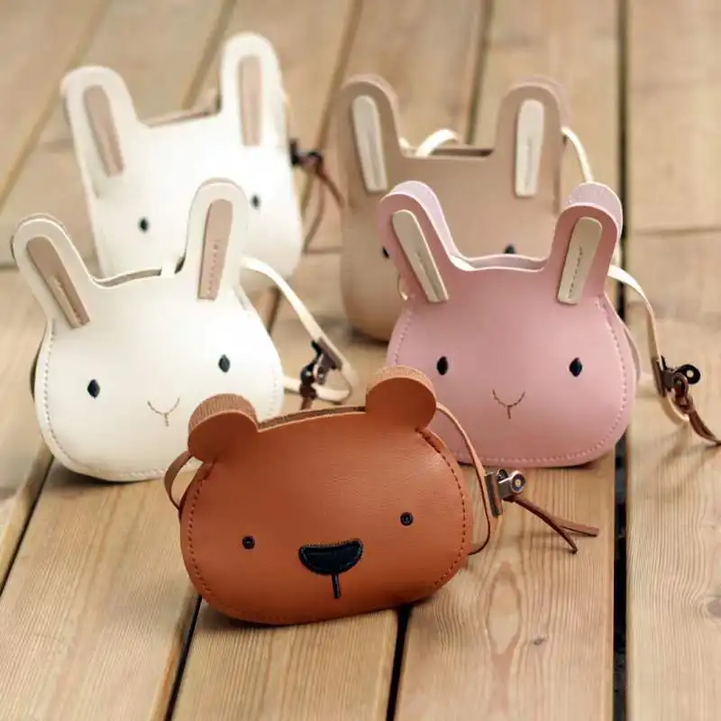 

Korean-style cute kids' bag: PU cartoon animal design with clip, 2-way crossbody/shoulder, perfect for trips & daily use!