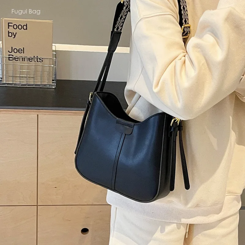 Bolso de mano minimalista y atmosférico para mujer, bandolera de un solo hombro con correa ancha, a la moda, nuevo