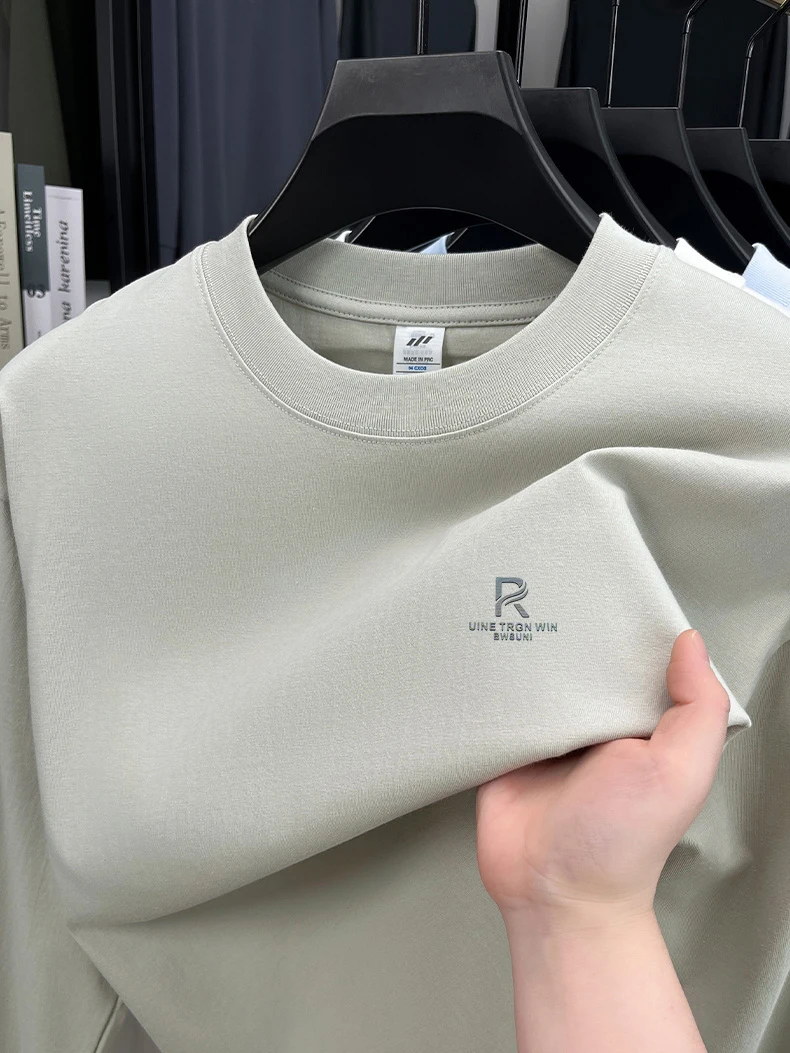 T-shirt a maniche lunghe da uomo in puro cotone di fascia alta 2025 Nuova primavera e autunno inverno girocollo allentato con cappuccio tinta unita da uomo