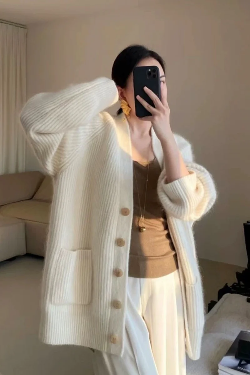 High-grade white sweater cardigan coat women's autumn and winter temperament loose thick long V-neck sweater outside.