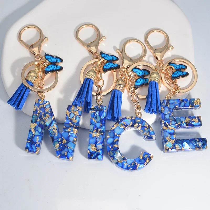 Fashion Blue Tassel Butterfly 26Letter Keychain Glazed Stone Sequin Filled Resin Metal Keyring for Women Men Car Handbag Pendant