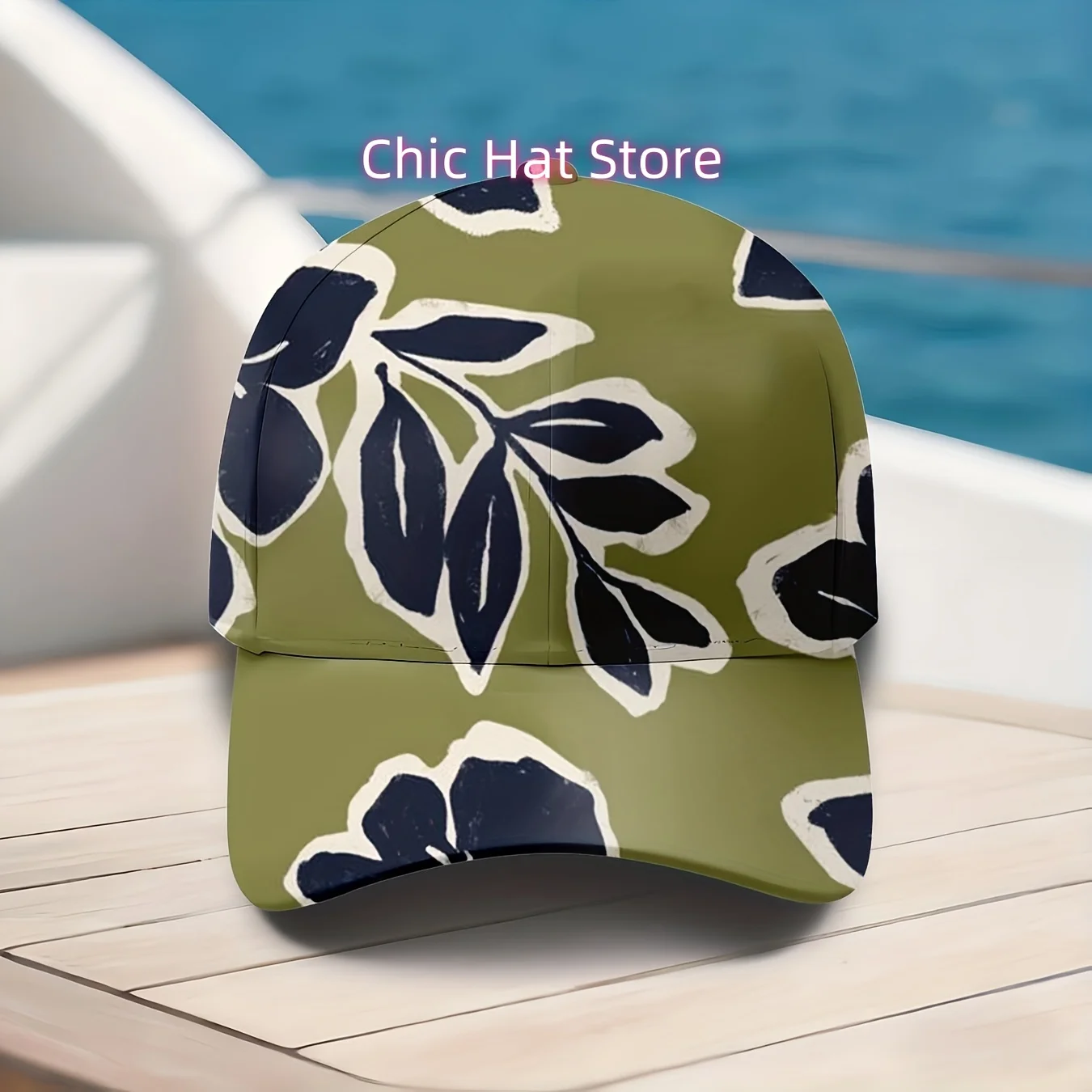 A Baseball Cap Featuring a Dark Blue Leaf Design on an Olive Green Backdrop, This Hat Showcases a Tropical Plant Motif, Perfect