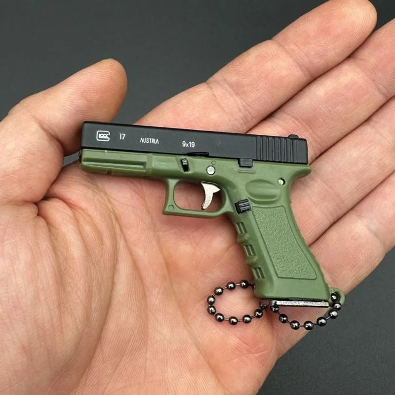 

2026 Hot New 1:3 Scale Glock G17 Mini Metal Alloy Gun Model Keychain Pendant Ornament Gift Toy for Kids Boys Adults Hobby Fans