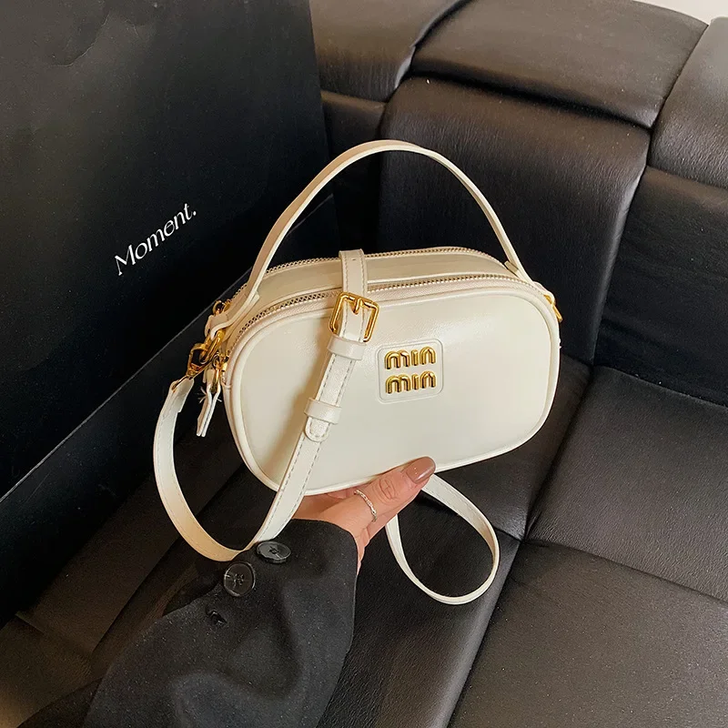 

High-End Leather Small Exquisite Messenger Camera Bowling Bag for Women - Work Commuting, Water-Resistant & Stylish