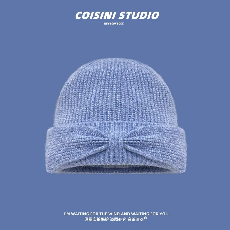 Koreanischer Stil Herbst- und Winter-Strickmütze mit einfacher Schleife für Damen, warme Ohrenschutz-Beanie-Mütze für Herbst und Winter. – Detail 2