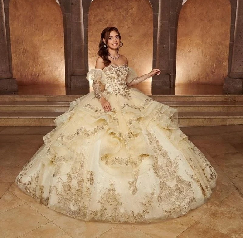 

Lorencia Champagne Quinceanera Dress Ball Gown Long Sleeve Gold Lace Appliques Ruffles Sweet 16 Dress Vestidos De XV Anos YQD373